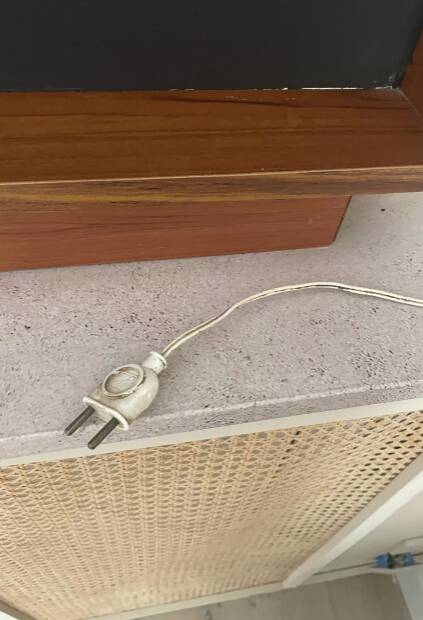 Scandinavian mirror with wooden frame and backlighting.