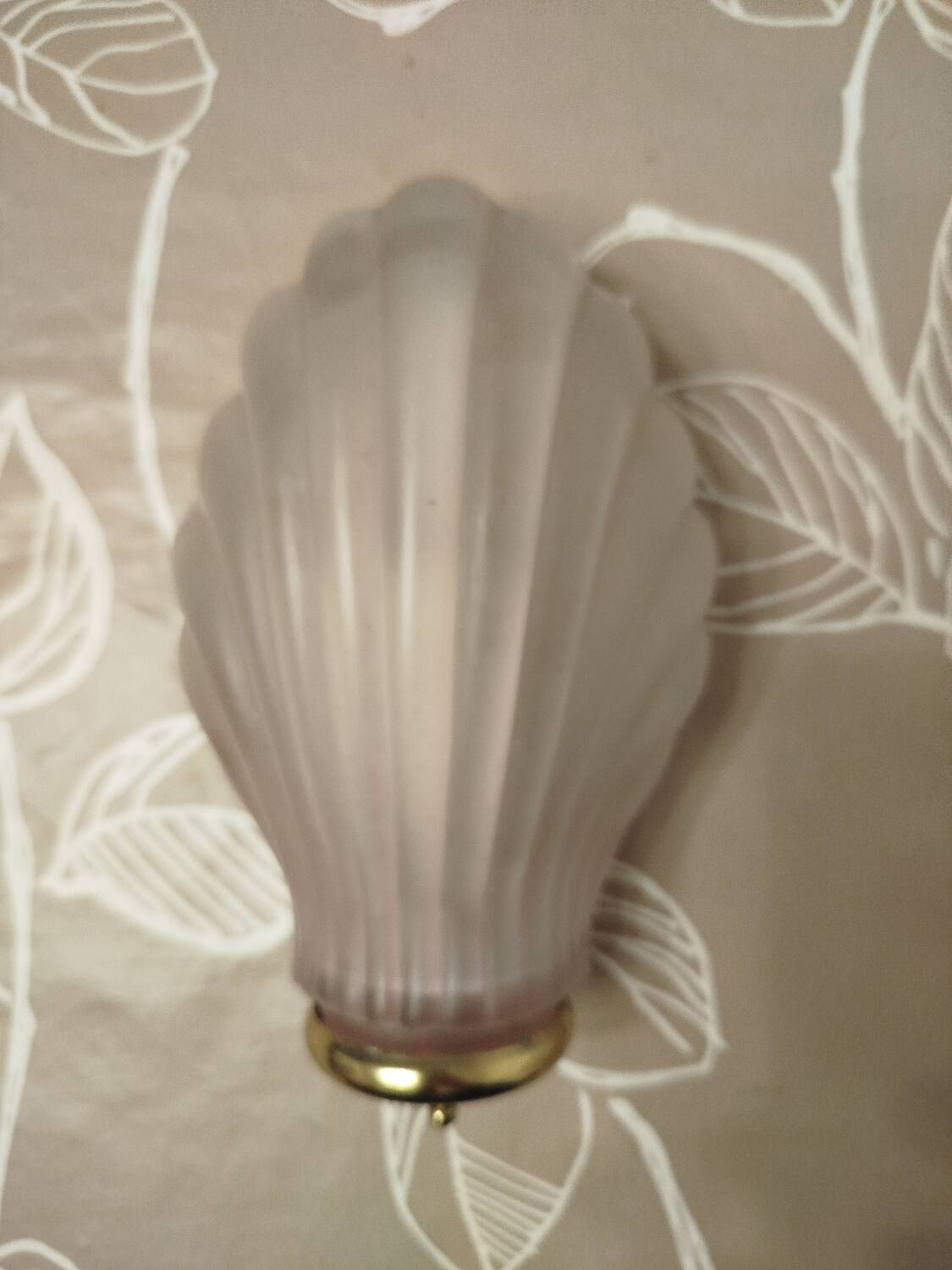 Art Deco wall sconce in frosted pink glass with a seashell design