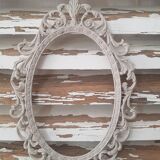 Oval frame molding patinated plant decoration