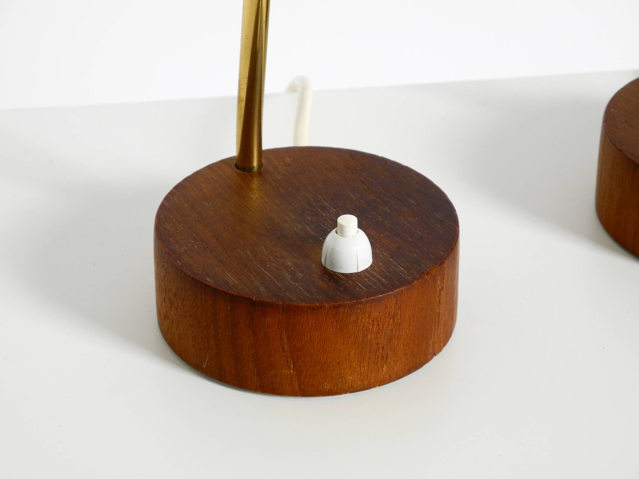 A pair of mid-century modern bedside lamps with perforated metal shades