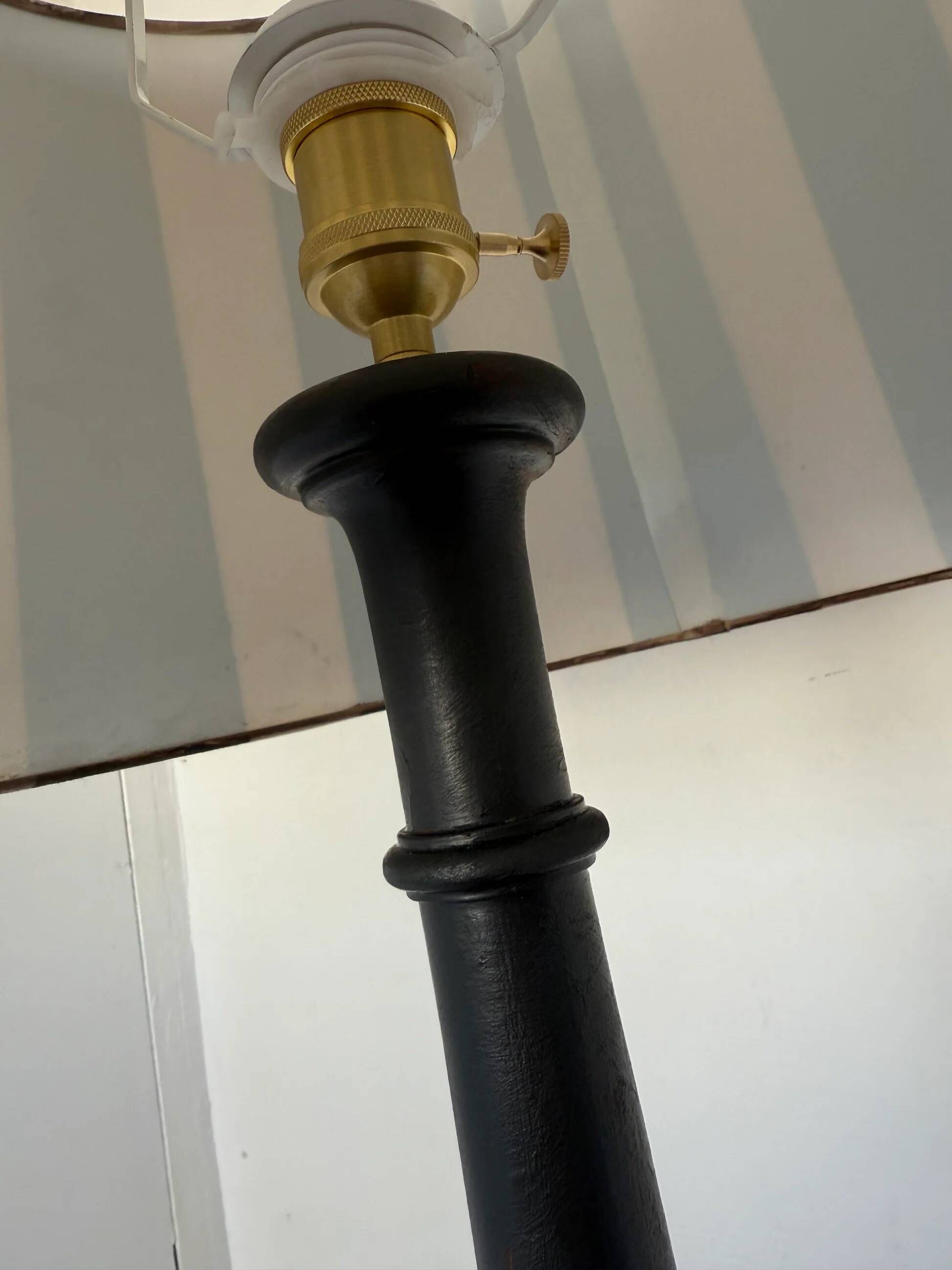 Vintage floor lamp in black patinated wood and striped lampshade