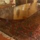 Extensible dining table from the Louis XVI period in mahogany with a banded top.