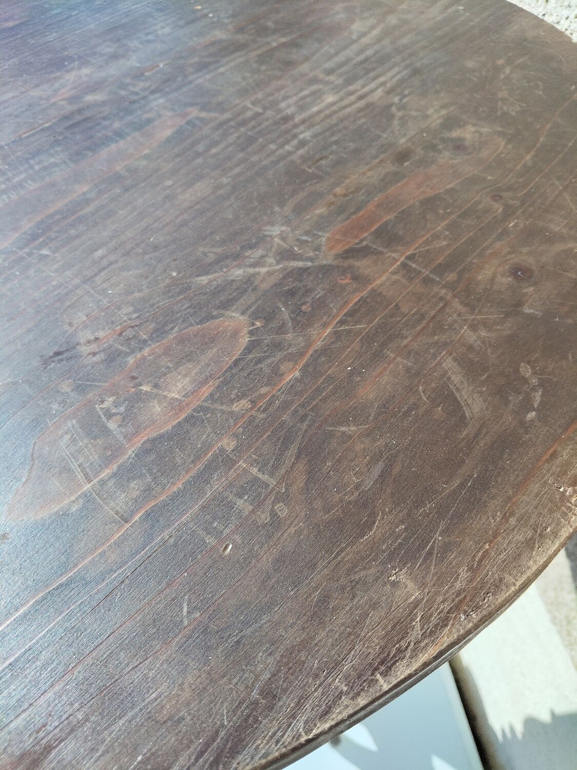 Small rustic antique tripod side table made of solid wood.