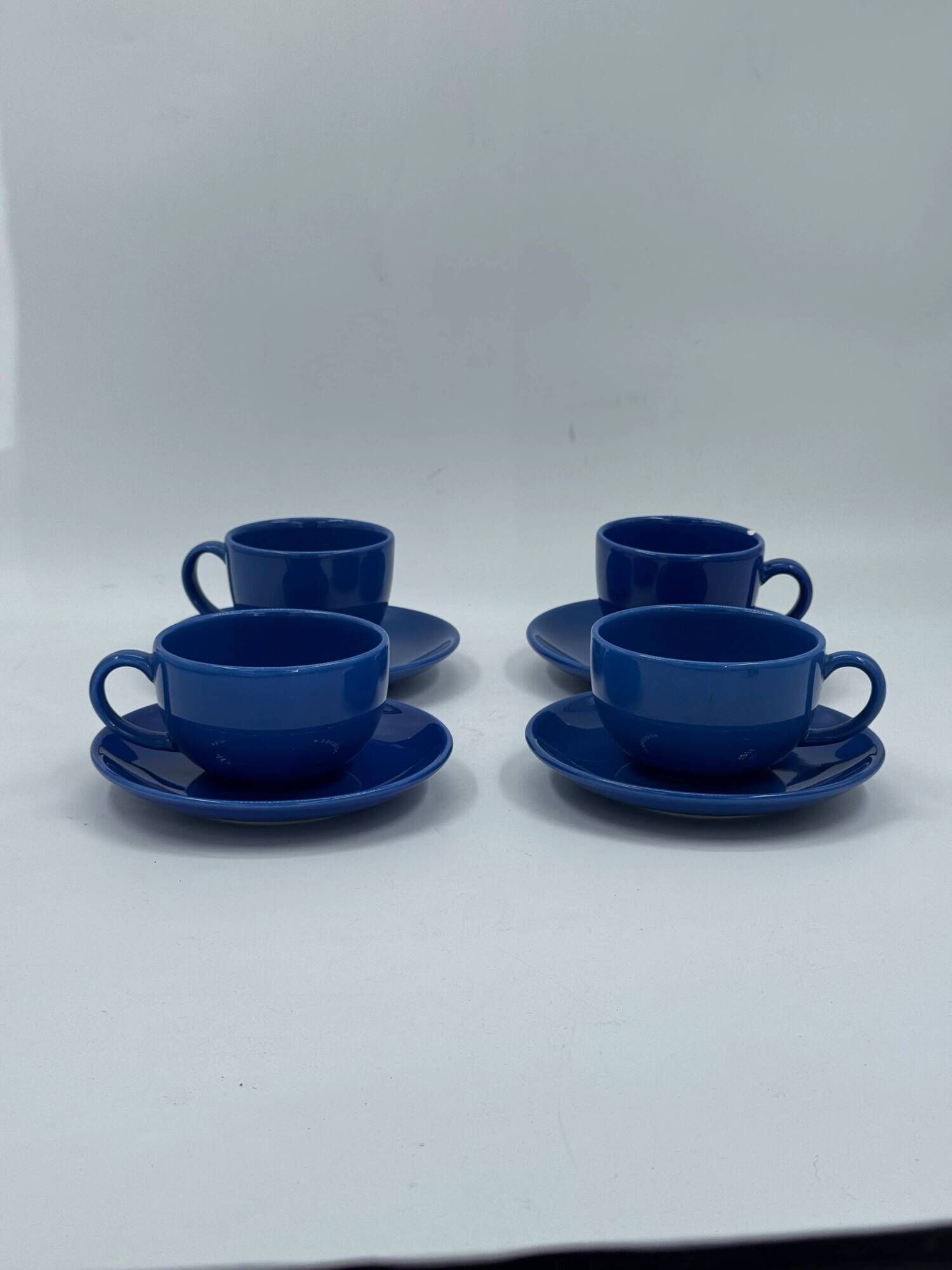 Set of 4 vintage blue ceramic cups and saucers.