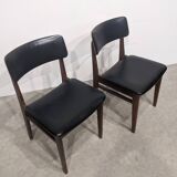 Two mid-century faux leather chairs