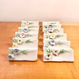 Set of 12 knife holders or porcelain table name holders