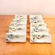 Set of 12 knife holders or porcelain table name holders
