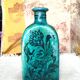 Antique Iranian three-sided blue ceramic bottle