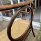 Antique Thonet bench in bent wood and caning, signed.
