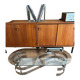 70s design oval coffee table in glass with chrome legs.