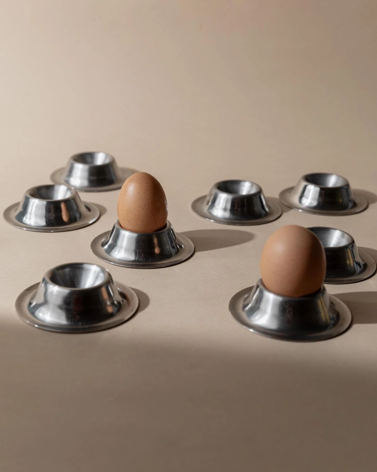 Lot of 9 vintage stainless steel egg cups from the 1970s, timeless minimalist design, dishwasher safe.