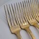 12 Table Forks in gold metal