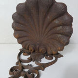 Old cast iron planter shell-shaped plant support