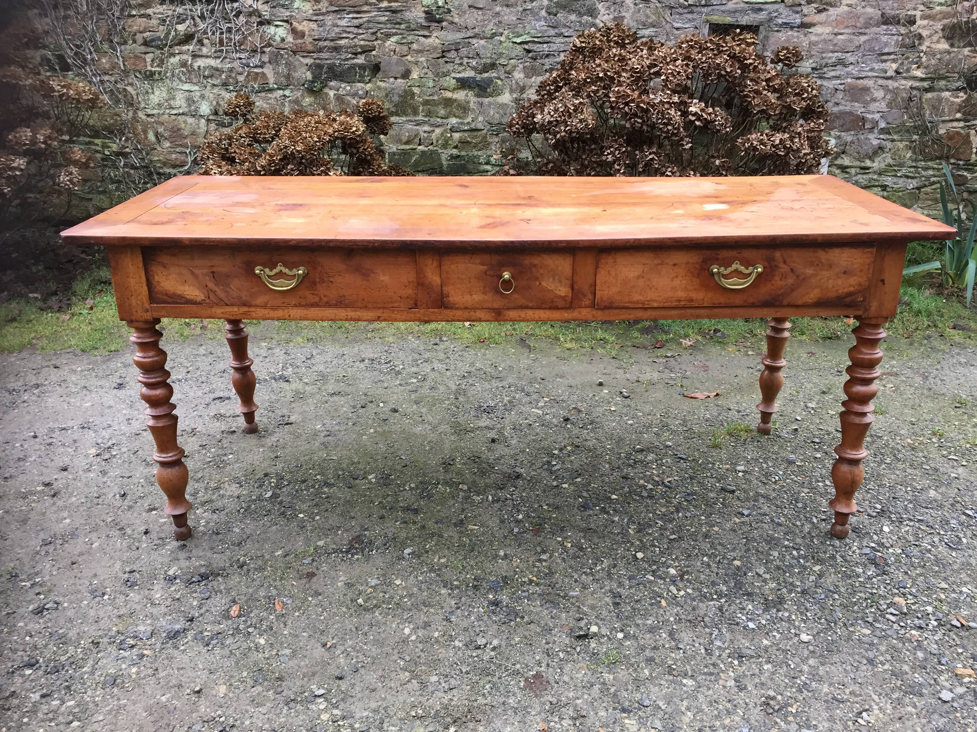 Old cherry farmhouse table with 3 drawers and turned legs