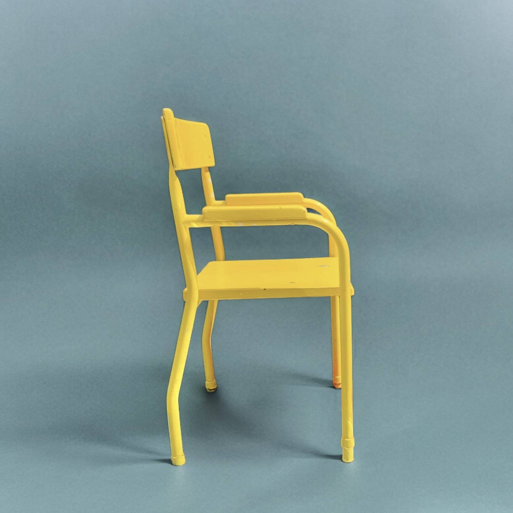 Vintage children's chair in yellow painted wood and metal