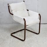 Tubular armchair, fabric suspended seat. Circa 1970