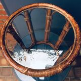 Round table in rattan and glass