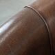 Set of two sheepskin club armchairs with fixed seat cushions