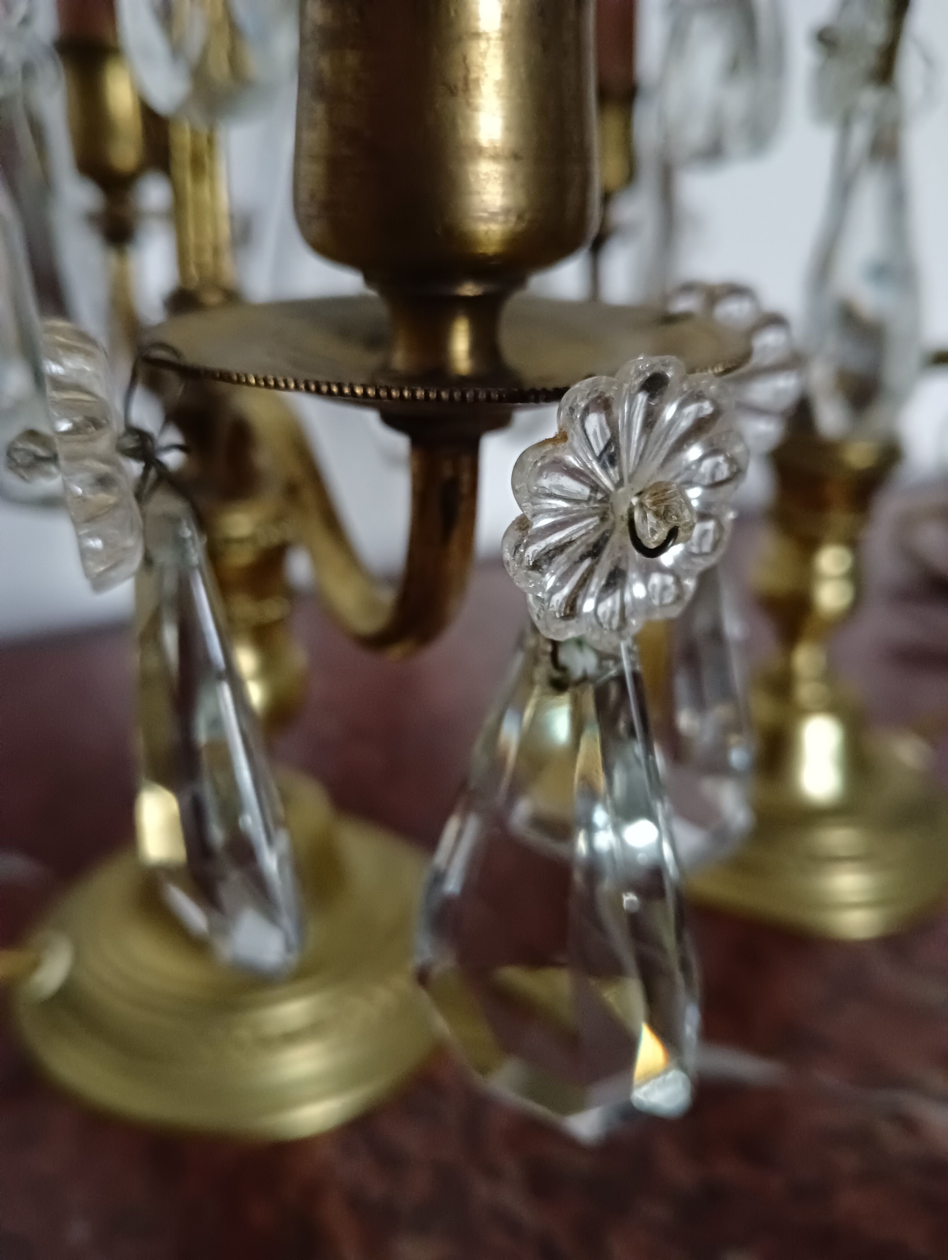 Pair of bronze girandoles with crystal pendants, two arms of lights.