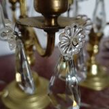 Pair of bronze girandoles with crystal pendants, two arms of lights.