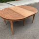 Renovated round extendable dining table made of solid mahogany from the 19th century.