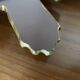 Vintage sun mirror in golden resin 60s/70s