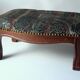Small foot stool made of wood with upholstery, vintage from the 70s