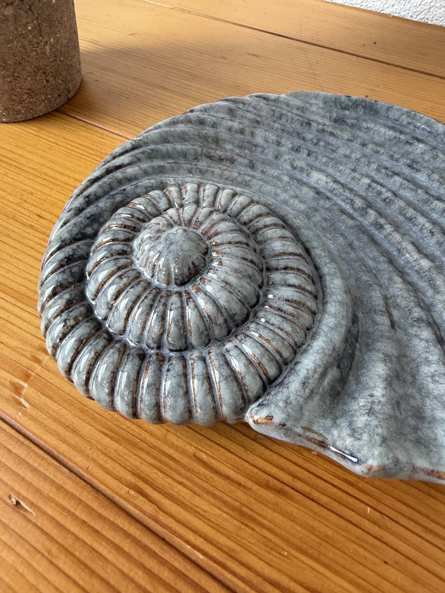 Shell-shaped ceramic catchall.