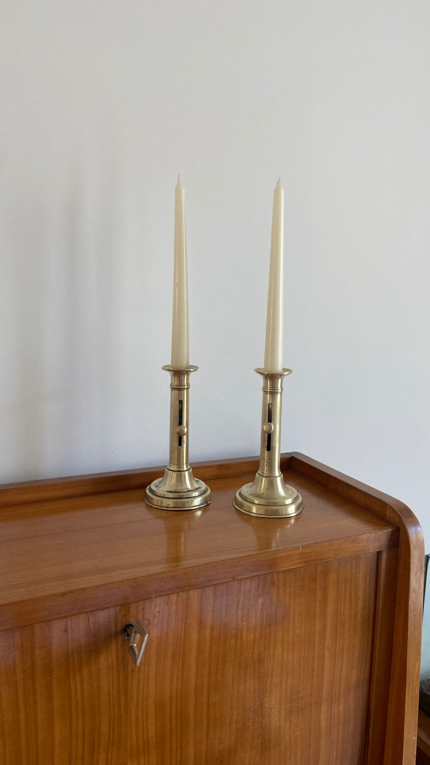 Pair of antique brass push candlesticks