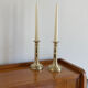 Pair of antique brass push candlesticks