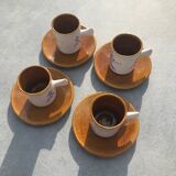 4 ceramic cups and saucers