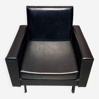 Black faux leather armchair