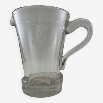 Large stylized glass pitcher