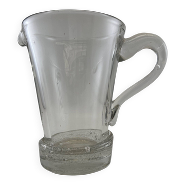 Large stylized glass pitcher