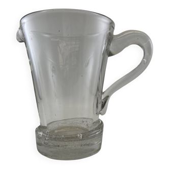 Large stylized glass pitcher