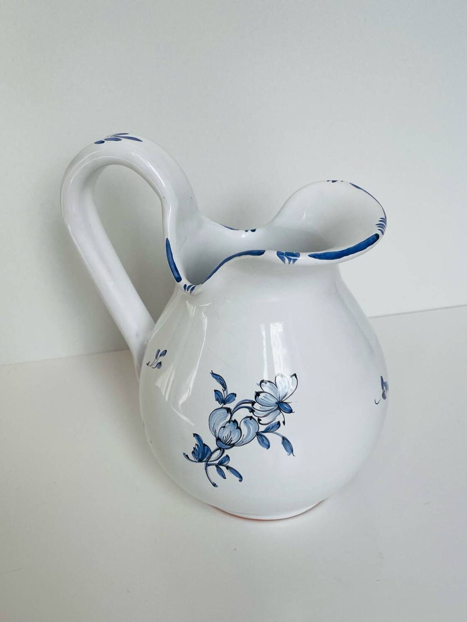 Moustiers pitcher with blue floral decoration
