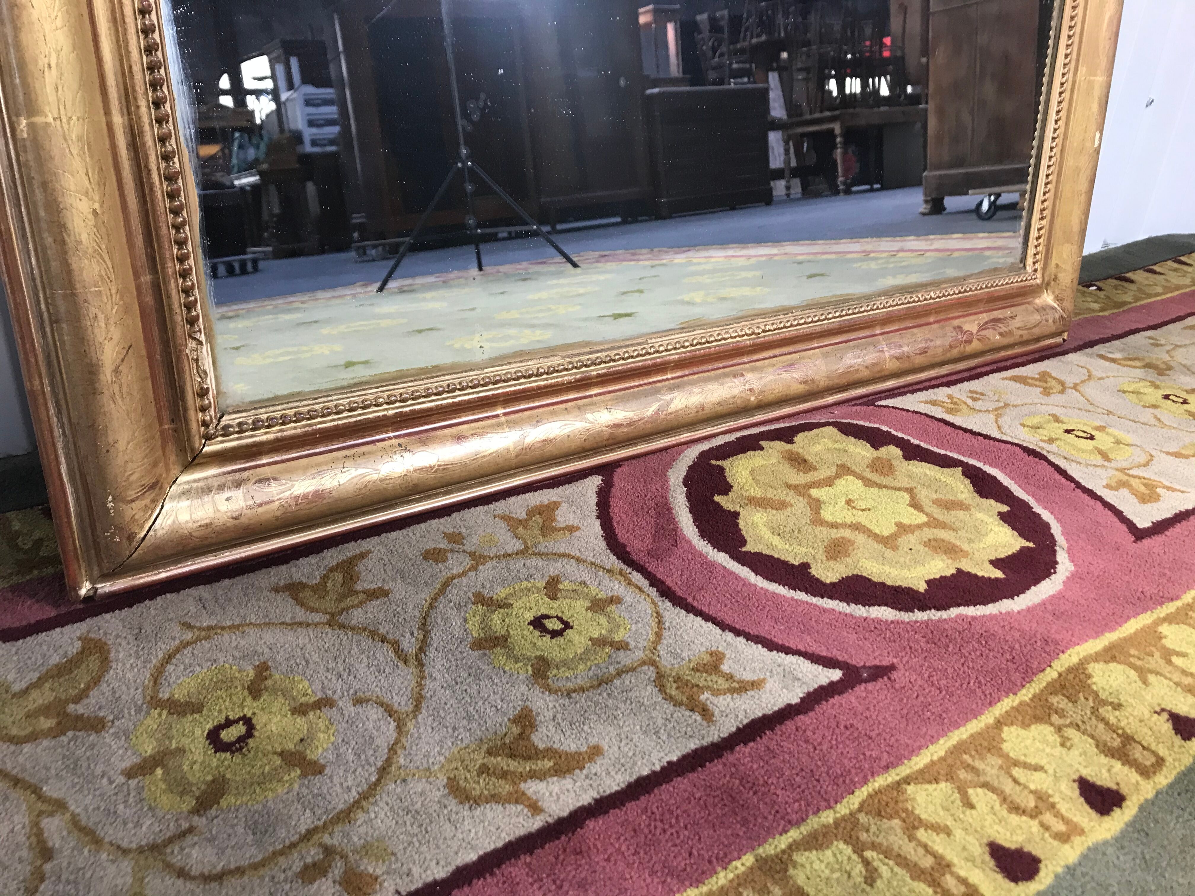 Louis Philippe's era mirror with a gold leaf pediment
