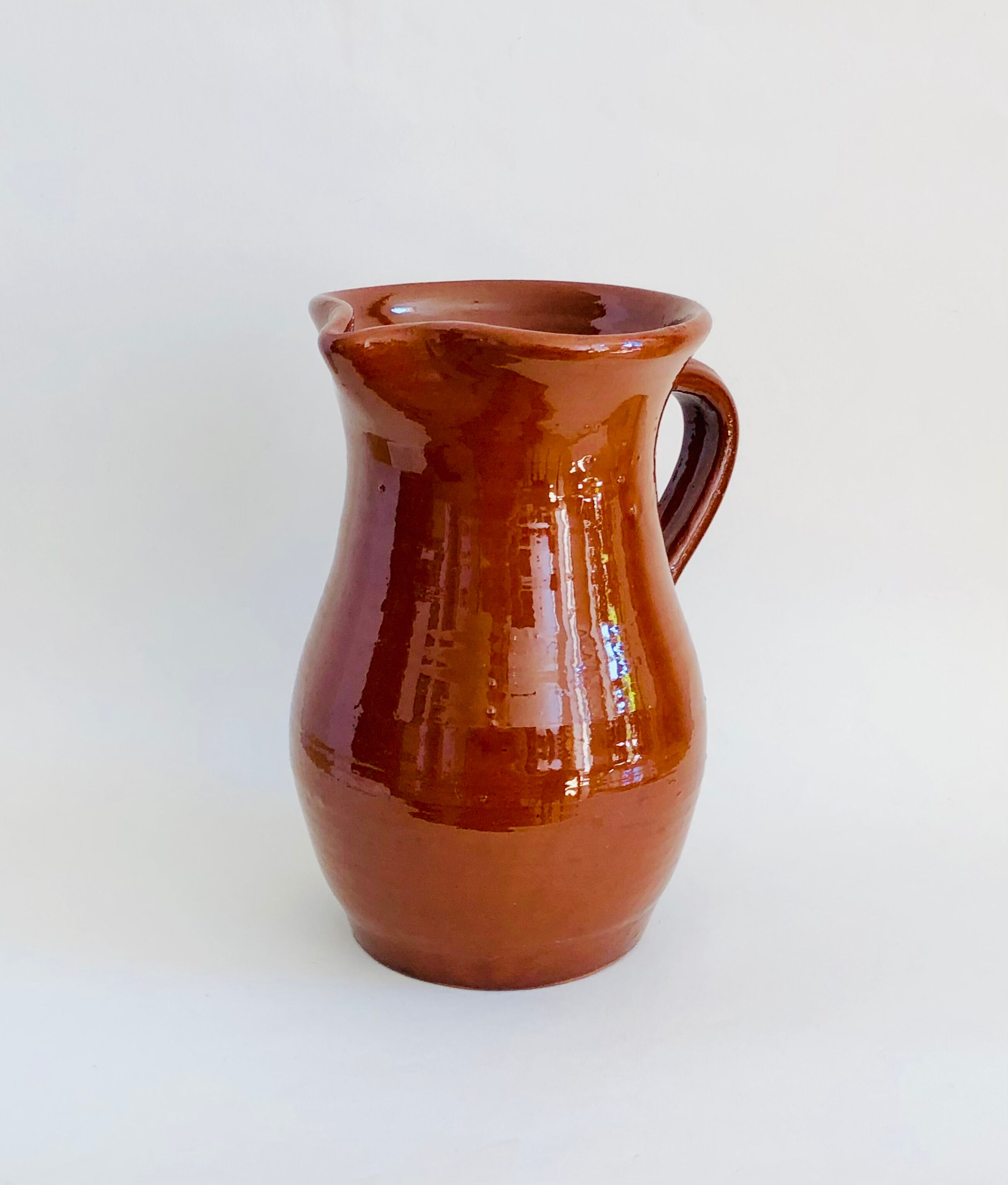Vintage pitcher in glazed earth