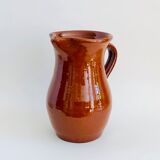 Vintage pitcher in glazed earth
