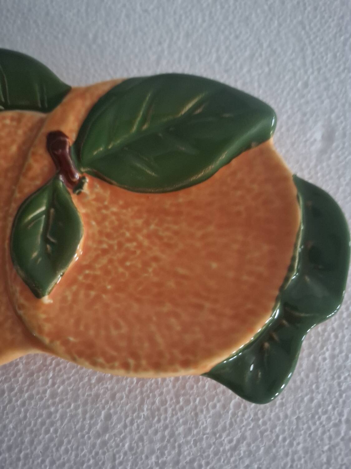 Orange trompe l'oeil slip dish.