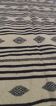Traditional hand-woven beige and black carpet