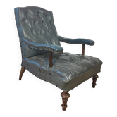 Fauteuil de bibliothèque ancien en cuir, datant des années 1860 environ.