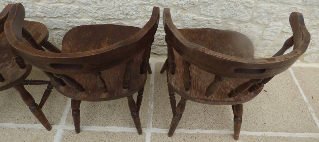 4 solid wood western-style "smoker's chairs" made of oak