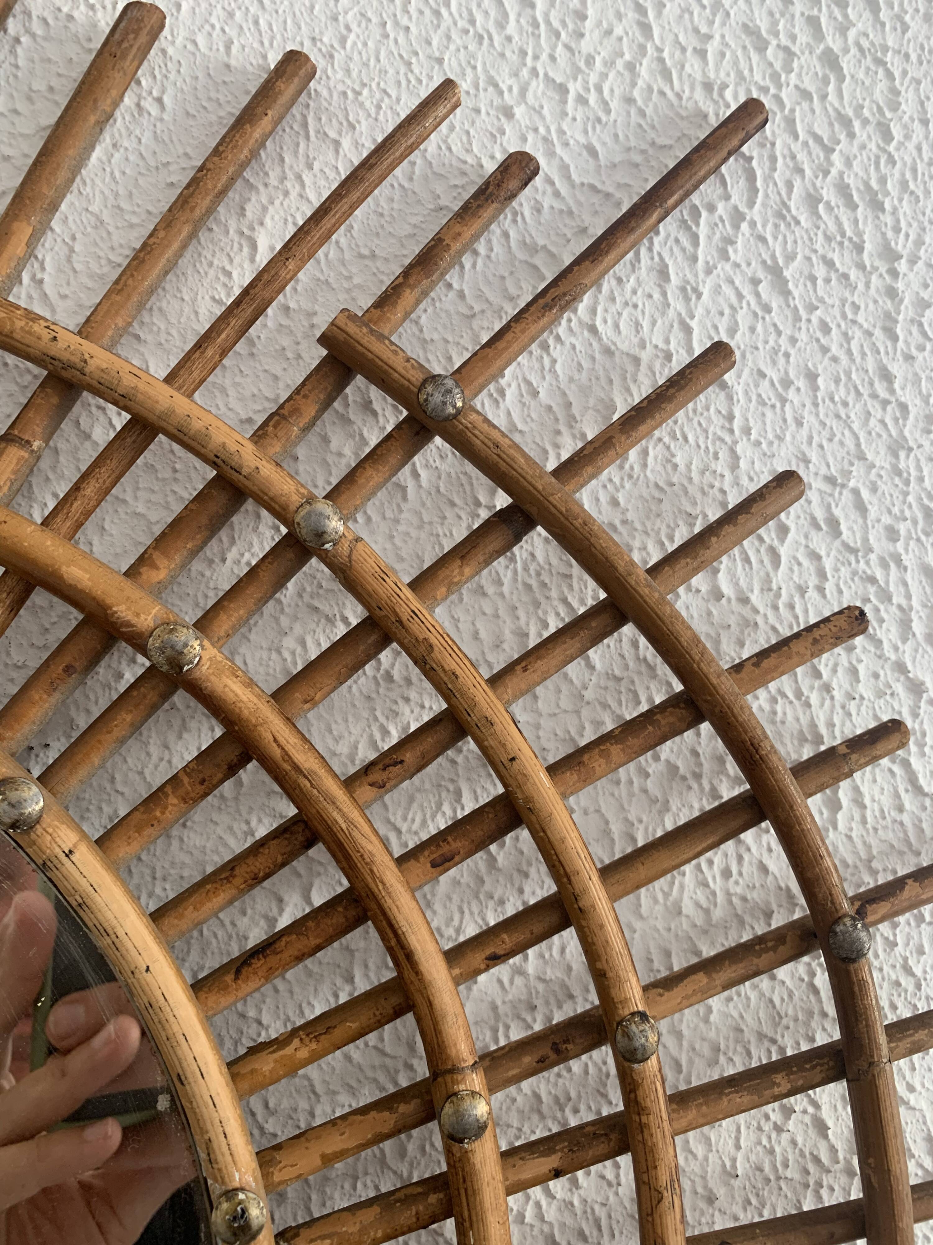 Vintage 1960s sunburst rattan ortf style spiral eye mirror - 90 x 67 cm