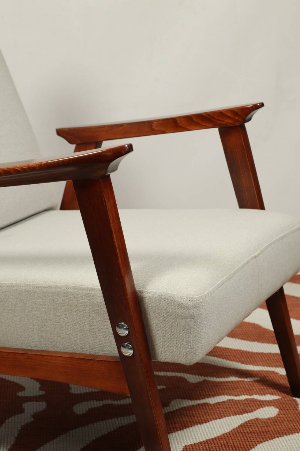 Vintage light gray armchair dark wood Scandinavian design 1970