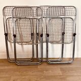 4 chrome folding chairs by Talin Cornedo