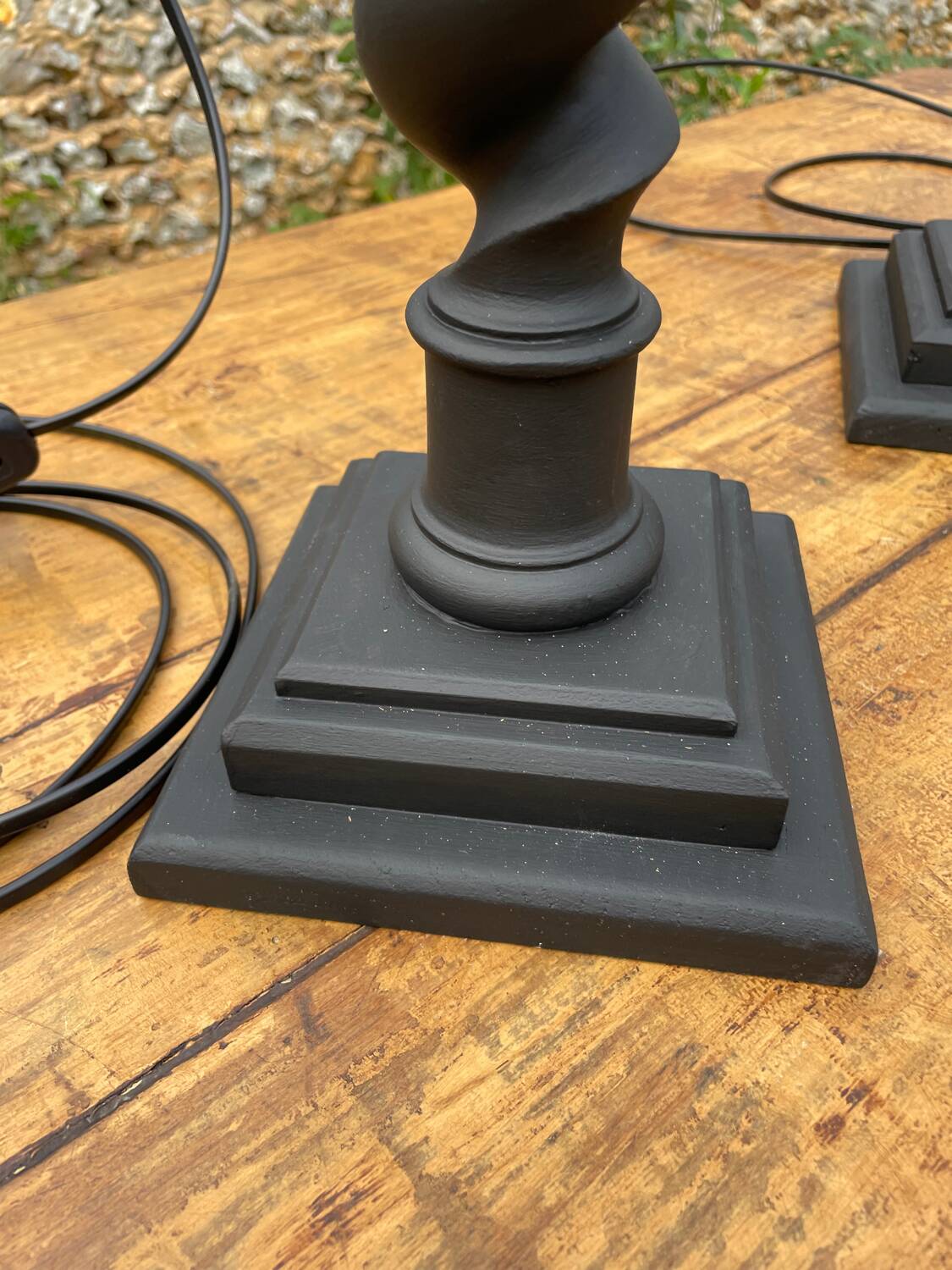 Pair of antique black twisted lamps