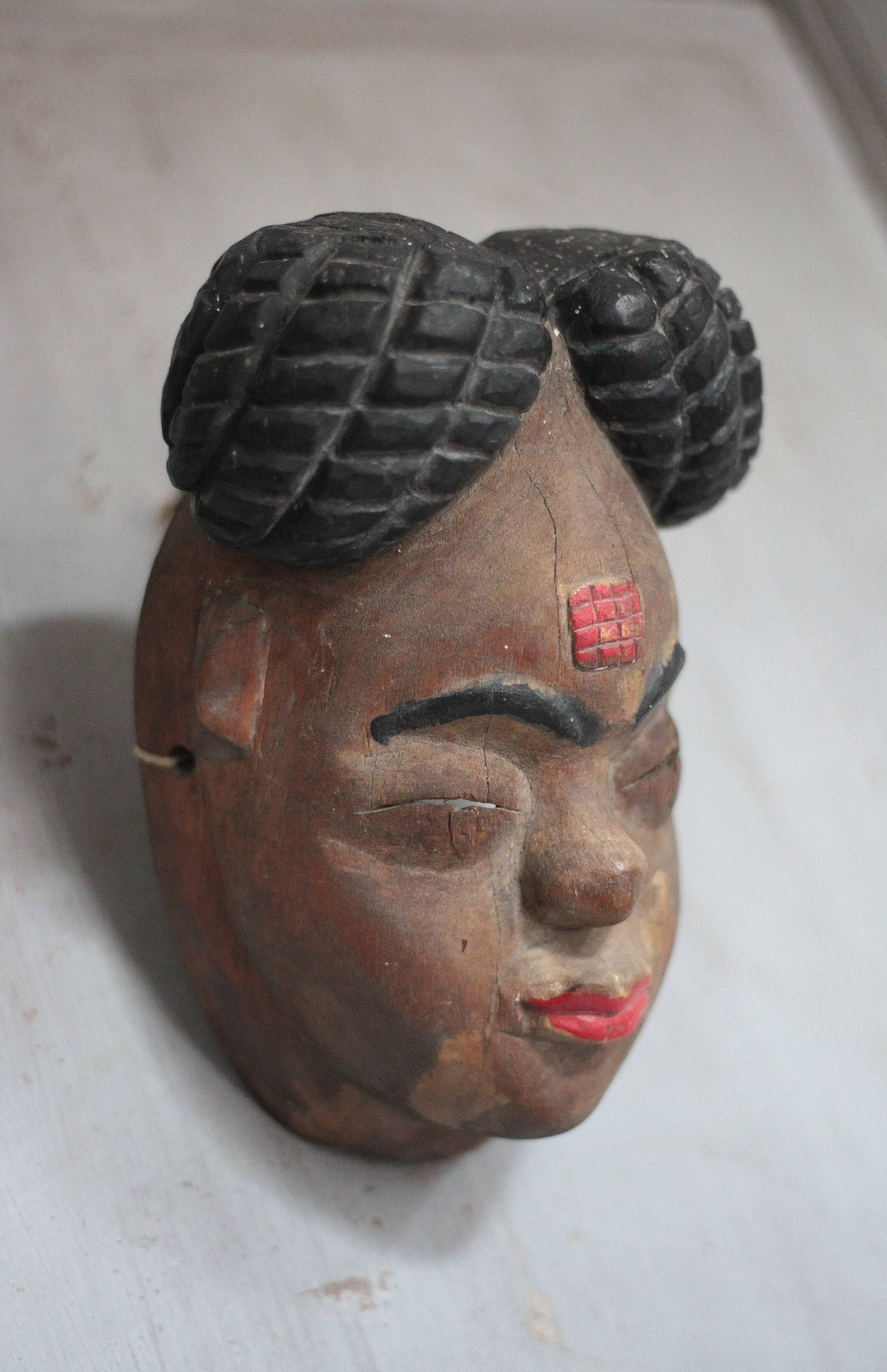 Ancient Okuyi mask, Punu mask from Gabon, carved wood, collection, ethnic art.