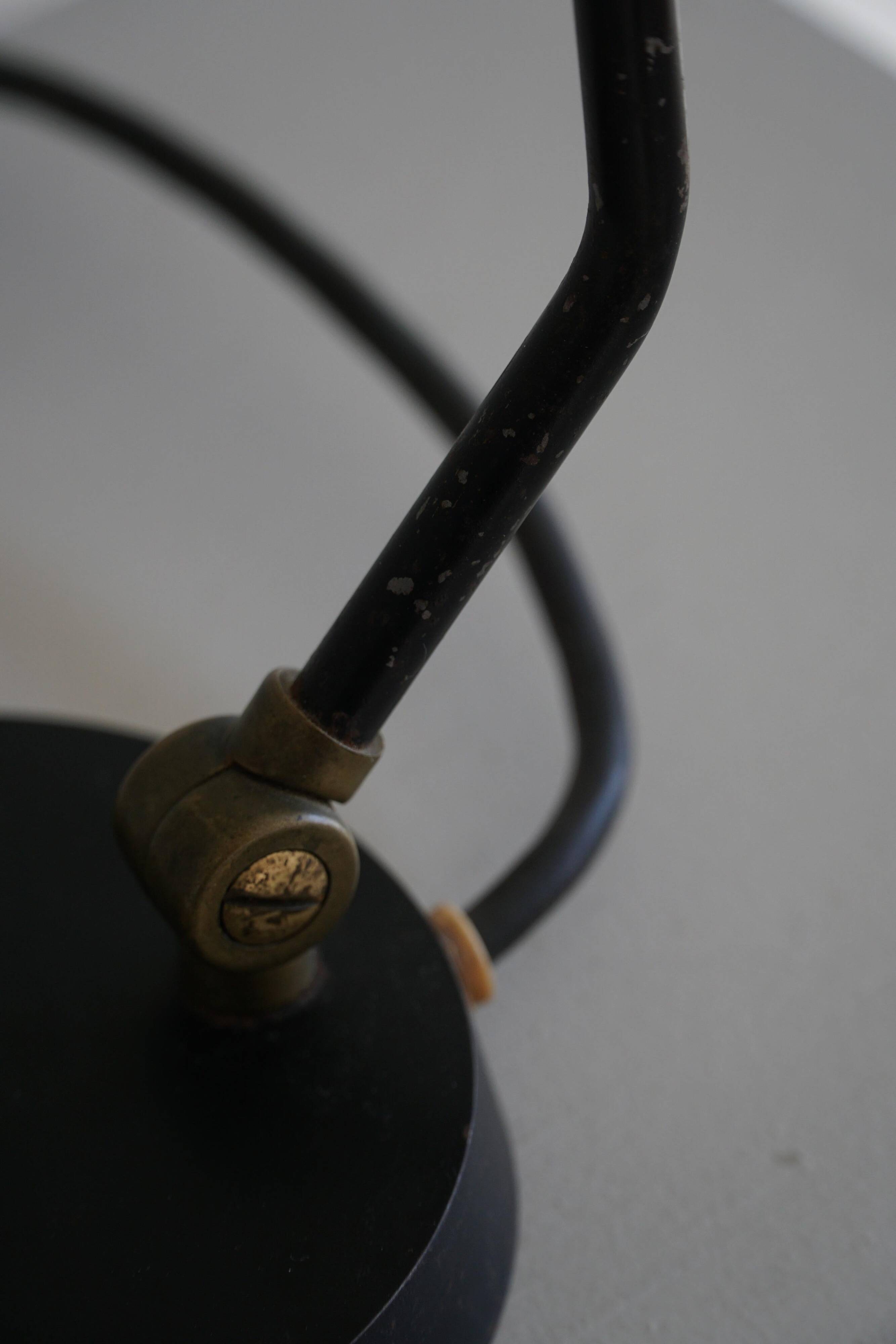 Modern adjustable Danish table lamp in metal, made by Louis Poulsen, 1950s.