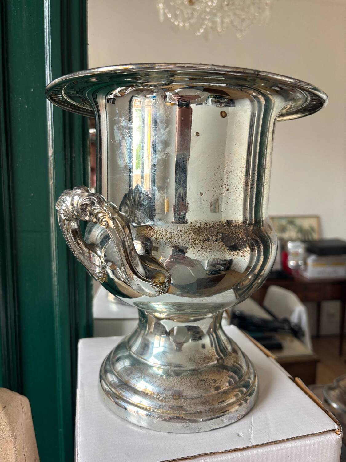 Silver metal champagne bucket.